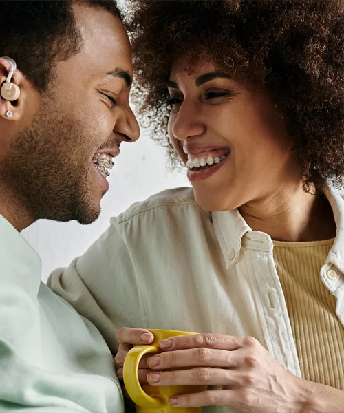 A young couple smiling with their faces close together